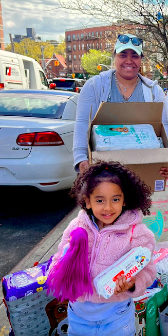 outreach image giving diapers